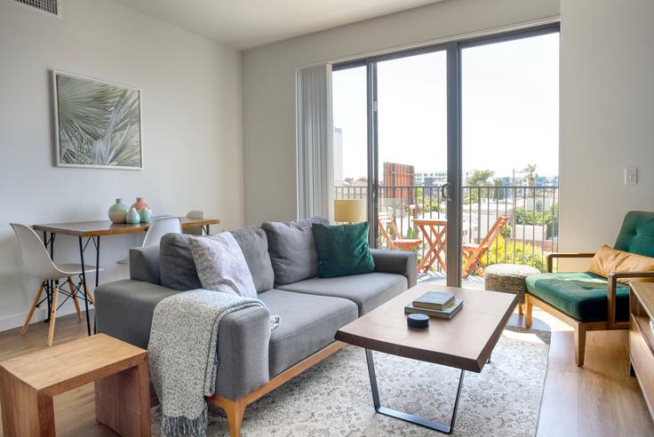 Elegantly designed living room with modern furnishings in an apartment at 3638 Motor Ave in Culver City, Los Angeles