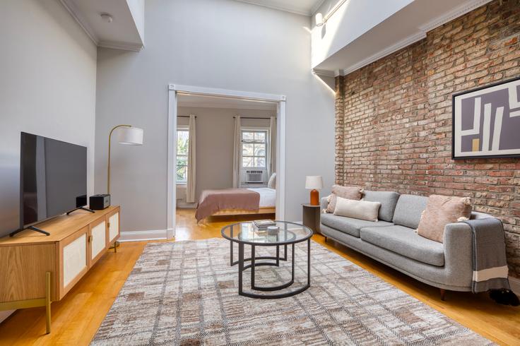 Elegantly designed living room with modern furnishings in an apartment at 120 Christopher Street in West Village, New York