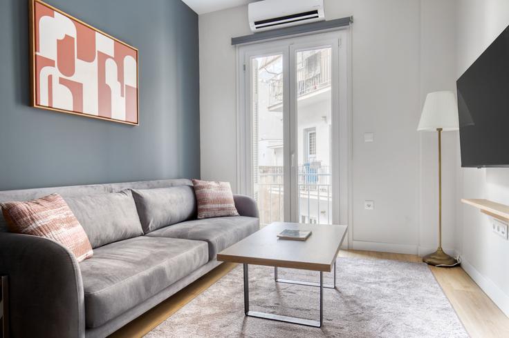 Elegantly designed living room with modern furnishings in an apartment at 573a5447-6aec-4bbd-91ed-6e27ea53b7bb in Pangrati, Athens