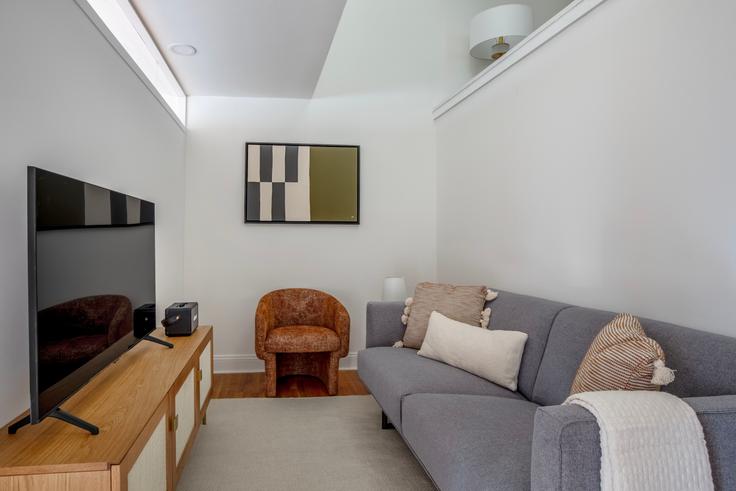 Elegantly designed living room with modern furnishings in an apartment at 123 E 54th in Midtown East, New York