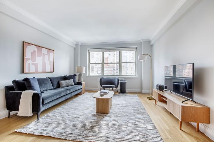 Elegantly designed living room with modern furnishings in an apartment at 41 Park Avenue in Murray Hill, New York