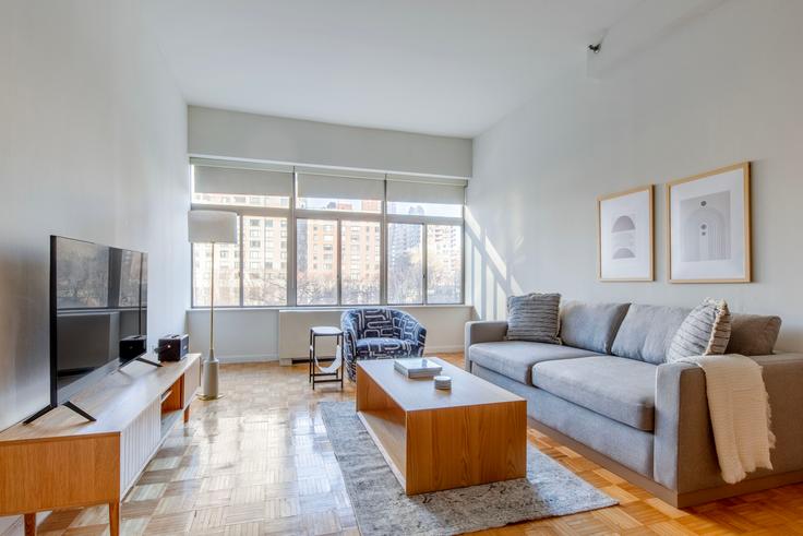 Elegantly designed living room with modern furnishings in an apartment at 90 Washington in Financial District, New York