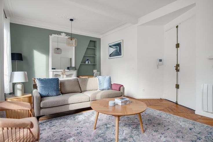 Elegantly designed living room with modern furnishings in an apartment at Maubeuge 82 in 9th arrondissement, Paris