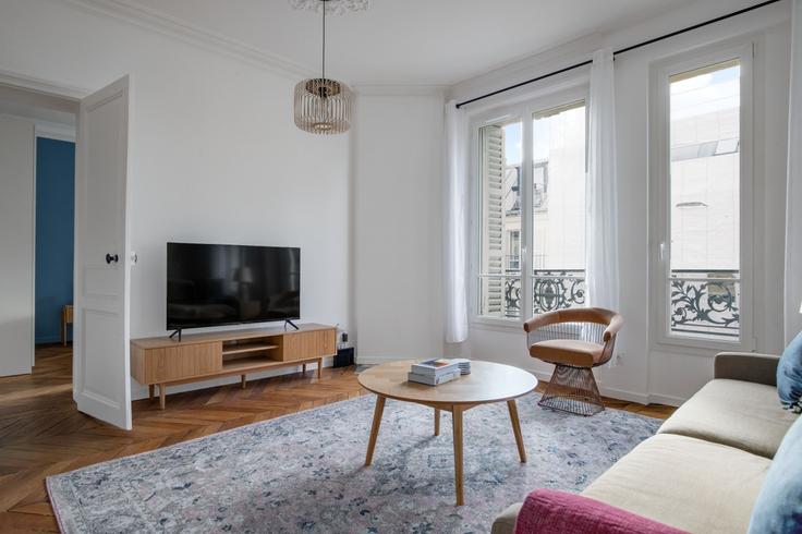 Elegantly designed living room with modern furnishings in an apartment at Maubeuge 82 in 9th arrondissement, Paris