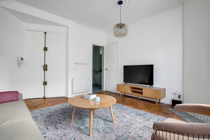 Elegantly designed living room with modern furnishings in an apartment at Maubeuge 82 in 9th arrondissement, Paris