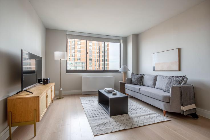 Elegantly designed living room with modern furnishings in an apartment at Normandie Court 215 in Upper East Side, New York