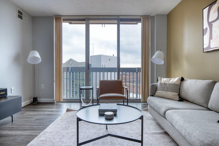 Elegantly designed living room with modern furnishings in an apartment at Palisades of Bethesda in Bethesda, Washington D.C.