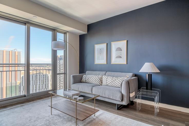 Elegantly designed living room with modern furnishings in an apartment at Elevate in East Cambridge, Boston