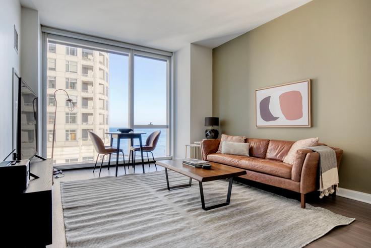 Elegantly designed living room with modern furnishings in an apartment at 500 Lake Shore in Streeterville, Chicago