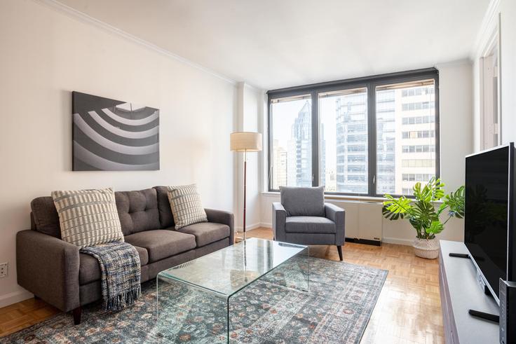 Elegantly designed living room with modern furnishings in an apartment at 150 East 57th Street in Midtown East, New York