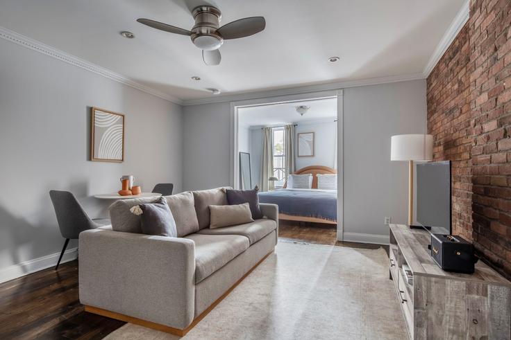 Elegantly designed living room with modern furnishings in an apartment at 120 Christopher Street in West Village, New York