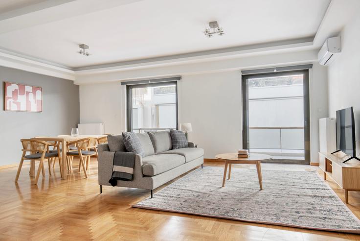 Elegantly designed living room with modern furnishings in an apartment at 7d4970c0-1477-4a66-9551-7a4084600d21 in Kolonaki, Athens