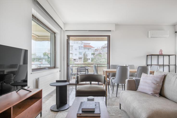 Chic living room with minimalist design from a furnished apartment in Voula, Athens