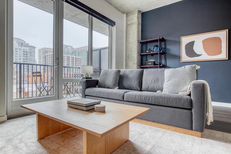 Elegantly designed living room with modern furnishings in an apartment at Hugo in River North, Chicago