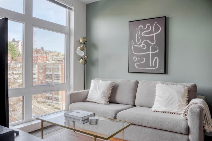 Elegantly designed living room with modern furnishings in an apartment at Roystone in Lower Queen Anne, Seattle