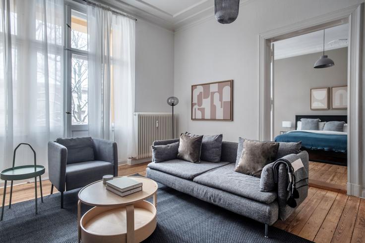 Elegantly designed living room with modern furnishings in an apartment at Johannisberger in Charlottenburg, Berlin