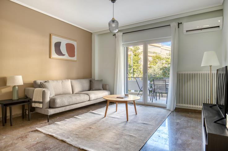 Chic living room with minimalist design from a furnished apartment in Agia Paraskevi, Athens