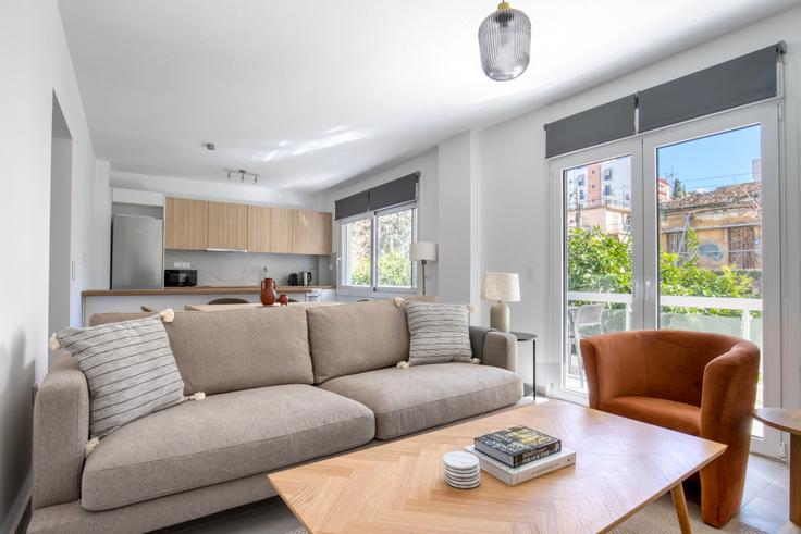 Elegantly designed living room with modern furnishings in an apartment at b310ab79-8ea0-4b1a-ac1a-d0c5a774d206 in Palaio Faliro, Athens