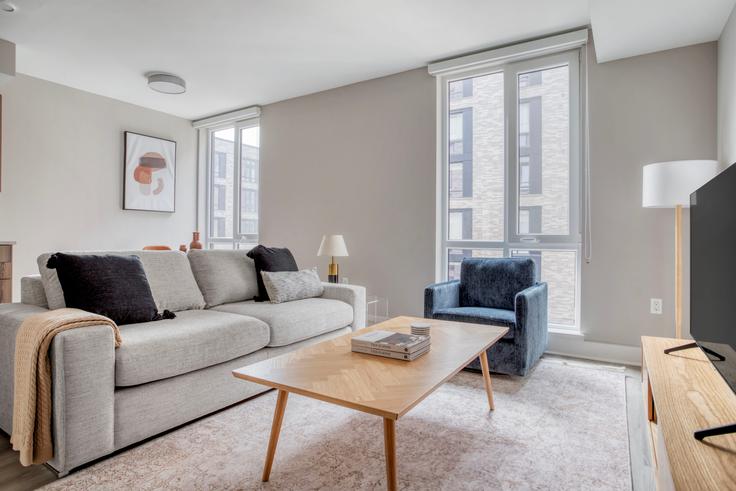 Elegantly designed living room with modern furnishings in an apartment at 44 Banner Lane in NoMa, Washington D.C.