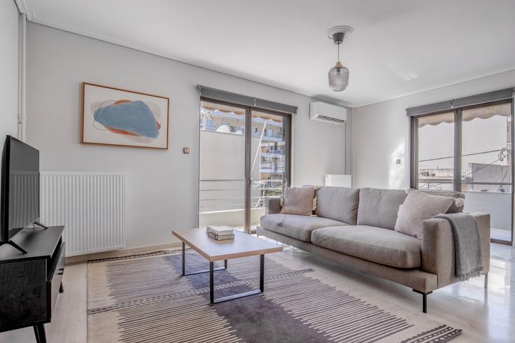 Chic living room with minimalist design from a furnished apartment in Alimos, Athens