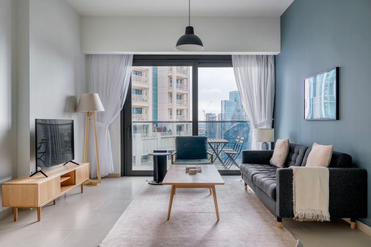 Salle de séjour élégante avec mobilier moderne dans un appartement à Act one act two tower à Downtown Dubai, Dubai Salle de séjour élégante avec mobilier moderne dans un appartement à Act one act two tower à Downtown Dubai, Dubai