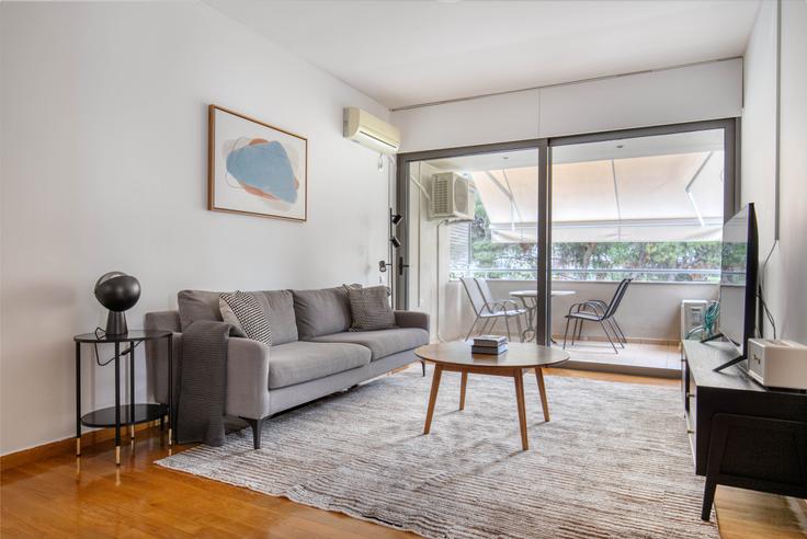 Chic living room with minimalist design from a furnished apartment in Vrilissia, Athens