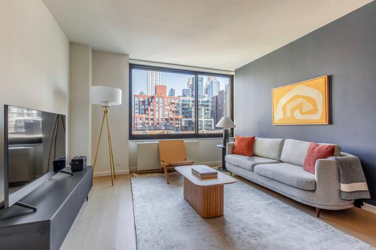 New York ManhattanのThe Westminsterのアパートメントにある、モダンな家具を備えたエレガントなデザインのリビングルーム New York ManhattanのThe Westminsterのアパートメントにある、モダンな家具を備えたエレガントなデザインのリビングルーム