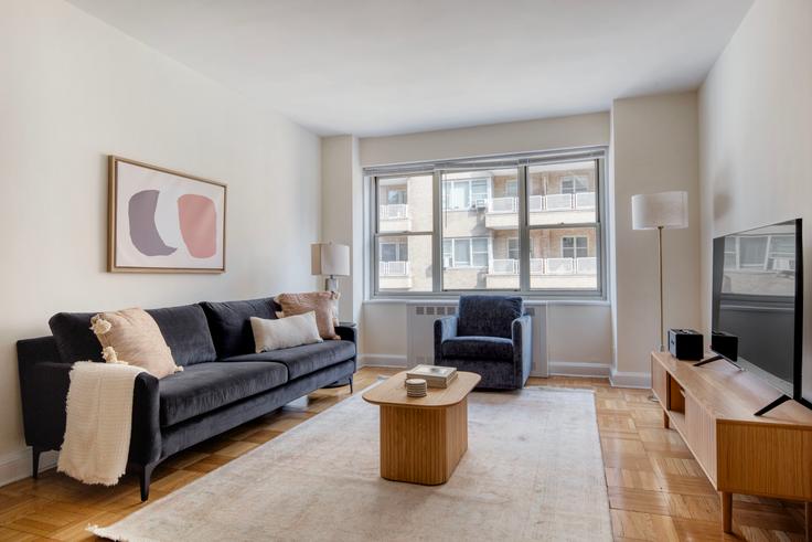 Elegantly designed living room with modern furnishings in an apartment at Monterey at Park in Murray Hill, New York