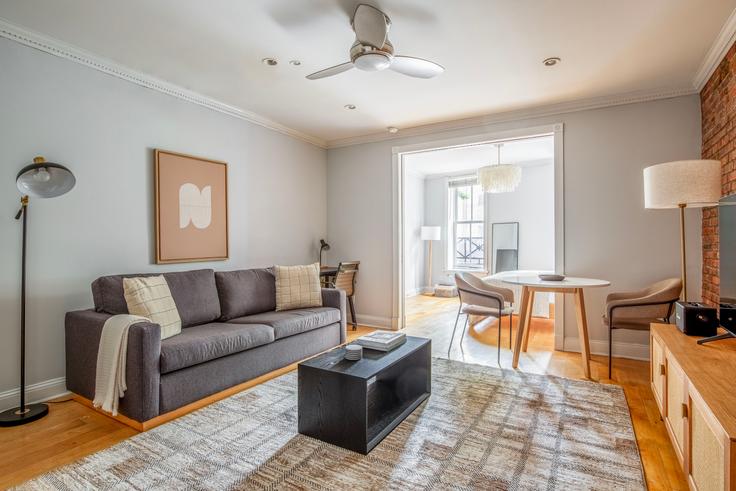 Elegantly designed living room with modern furnishings in an apartment at 120 Christopher Street in West Village, New York