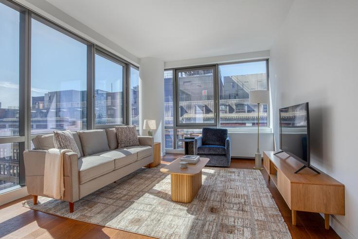 Elegantly designed living room with modern furnishings in an apartment at The Eugene in Hudson Yards, New York