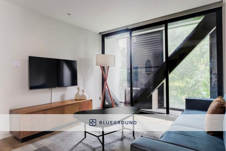 Elegantly designed living room with modern furnishings in an apartment at Insurgentes 432 in Roma Sur, Mexico City