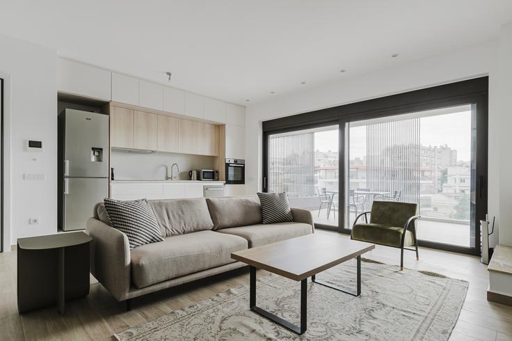 Elegantly designed living room with modern furnishings in an apartment at Ethelonton I in Palaio Faliro, Athens