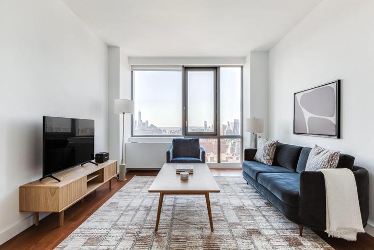 Elegantly designed living room with modern furnishings in an apartment at The Eugene in Hudson Yards, New York