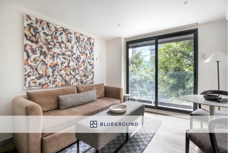 Salle de séjour élégante avec mobilier moderne dans un appartement à Río Nazas 23 à Mexico City, Mexico City Salle de séjour élégante avec mobilier moderne dans un appartement à Río Nazas 23 à Mexico City, Mexico City