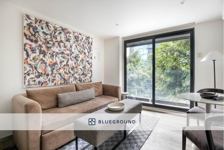 Elegantly designed living room with modern furnishings in an apartment at Río Nazas 23 in Cuauhtémoc, Mexico City