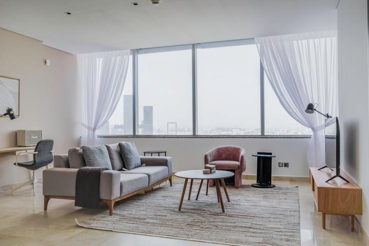 Elegantly designed living room with modern furnishings in an apartment at Sky Gardens in Sky Gardens Tower, Dubai