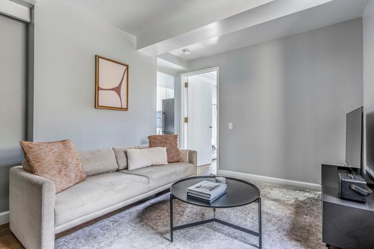 Elegantly designed living room with modern furnishings in an apartment at The Tempo in Upper West Side, New York