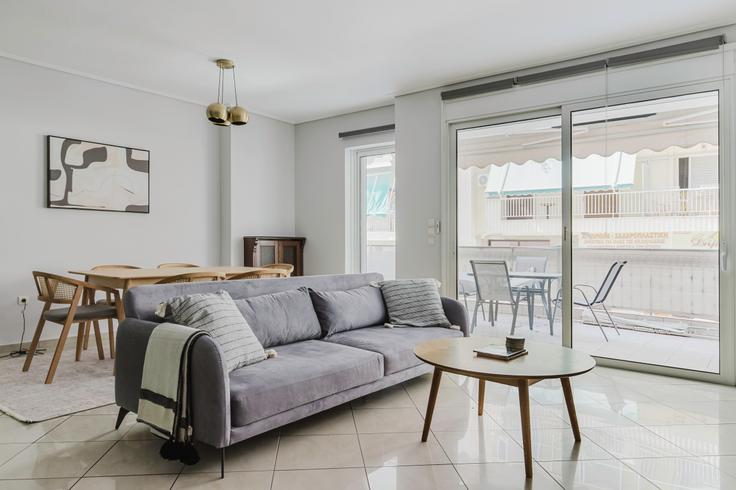 Elegantly designed living room with modern furnishings in an apartment at ffbbe6af-94ee-4f62-b77f-7155b1b1bd53 in Thiseio, Athens