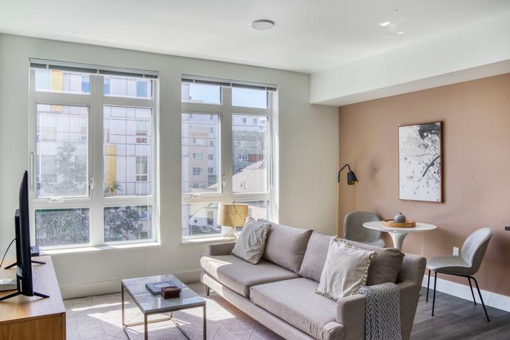 Elegantly designed living room with modern furnishings in an apartment at Tapestry Apartments in First Hill, Seattle