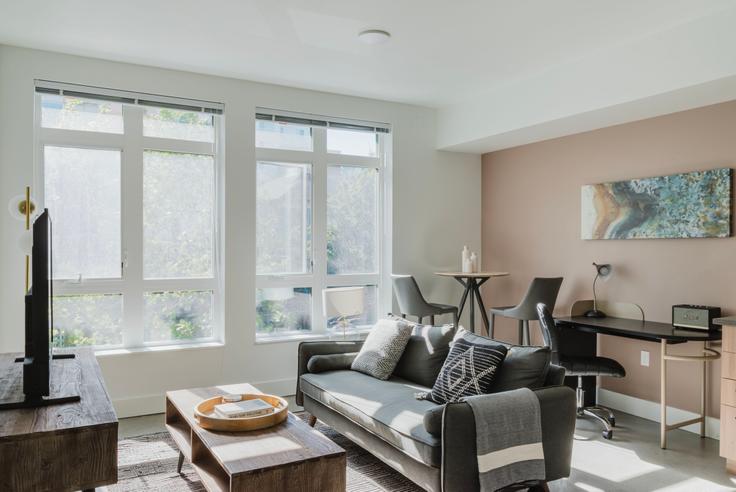 Elegantly designed living room with modern furnishings in an apartment at Tapestry Apartments in First Hill, Seattle