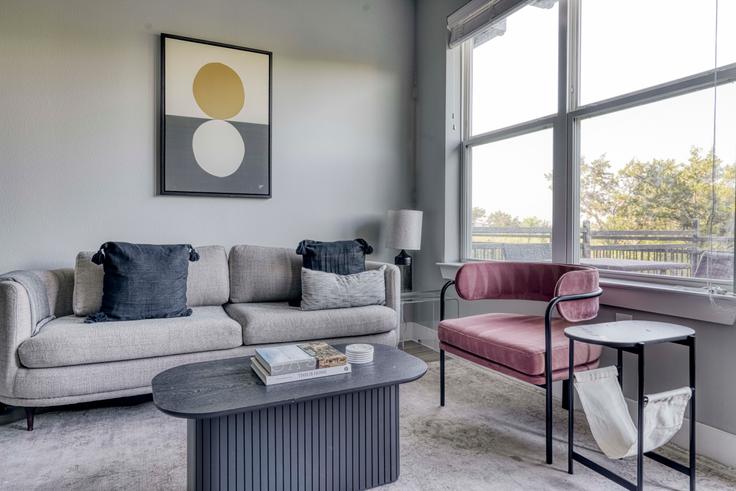 Elegantly designed living room with modern furnishings in an apartment at Camber Ranch in Lost Plains, Austin