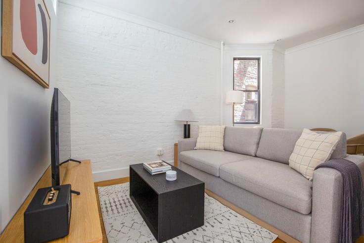 Elegantly designed living room with modern furnishings in an apartment at 403 E 69th in Upper East Side, New York