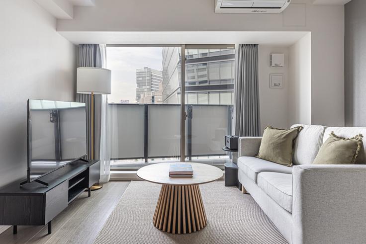 Elegantly designed living room with modern furnishings in an apartment at The Parkhabio Shibuya Cross in Shibuya Station, Tokyo