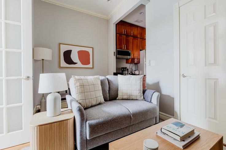 Elegantly designed living room with modern furnishings in an apartment at 234 West 14th in West Village, New York