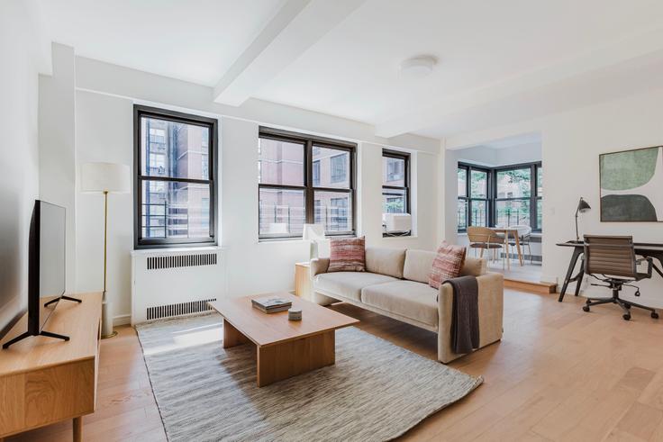 Elegantly designed living room with modern furnishings in an apartment at Rockefeller Court in Midtown East, New York