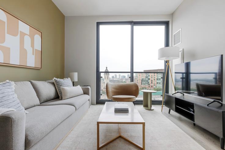 Elegantly designed living room with modern furnishings in an apartment at Westerly in River West, Chicago