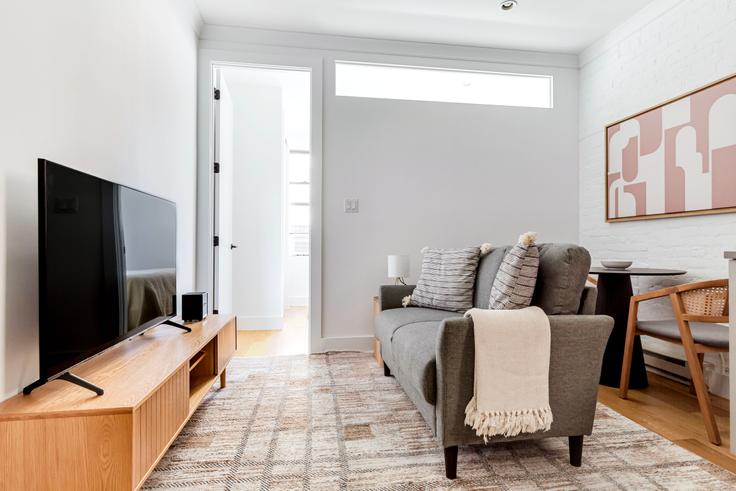 Elegantly designed living room with modern furnishings in an apartment at 1288 1st Ave in Upper East Side, New York