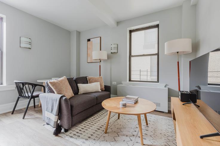 Elegantly designed living room with modern furnishings in an apartment at The Tempo in Upper West Side, New York