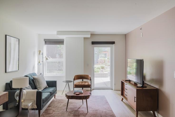 Elegantly designed living room with modern furnishings in an apartment at AVA Queen Anne 00N in Lower Queen Anne, Seattle