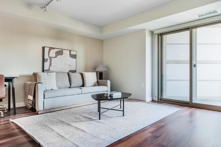 Elegantly designed living room with modern furnishings in an apartment at Randolph Towers in Ballston, Washington D.C.